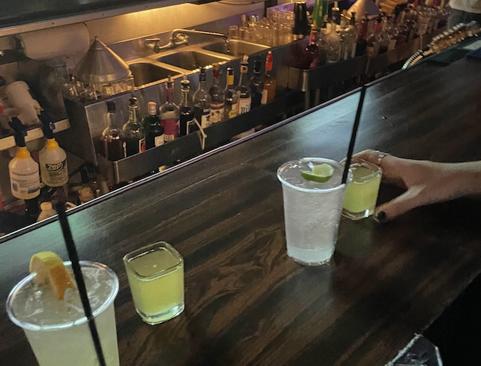 2 drinks and 2 shots at a bar